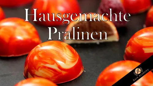 Titelbild des Back Academy Kurses Hausgemachte Pralinen mit rot marmorierten Pralinen