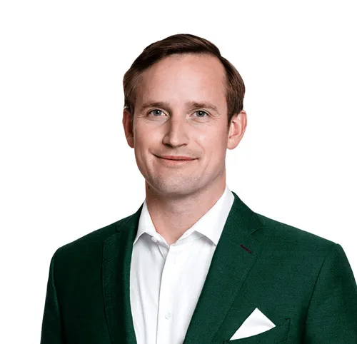 Porträt von Christoph J. F. Schreiber im grünen Sakko mit Einstecktuch