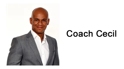 Coach Cecil im grauen Anzug mit weißem Hemd neben dem Schriftzug Coach Cecil